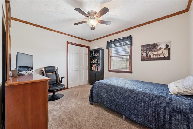 bedroom featuring light carpet, a desk, crown molding, a closet, and a textured ceiling