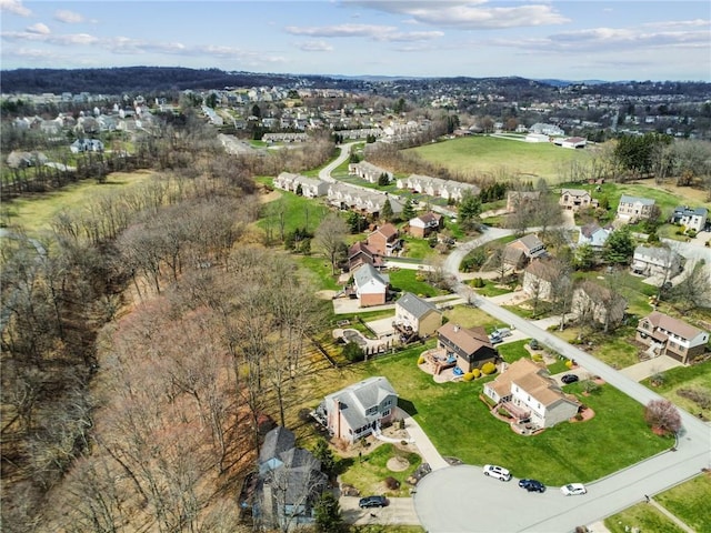 aerial overview of property's location with nearby suburban area