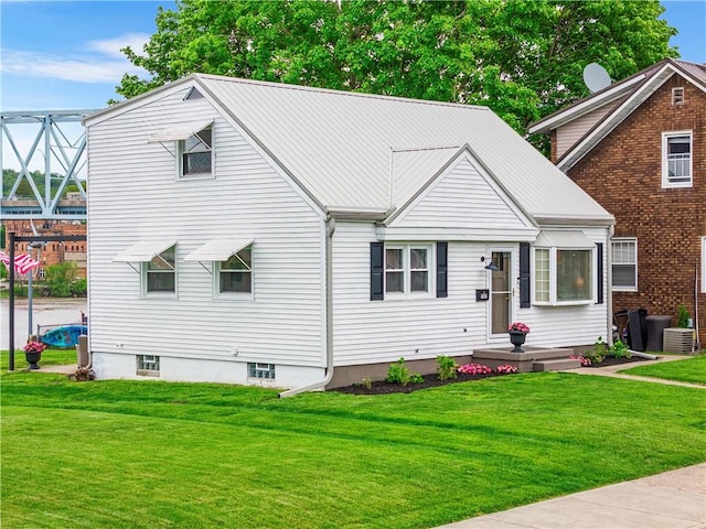 707 Atlantic Ave, Monaca, PA 15061 - view of front of house featuring a front yard, central AC unit, and metal roof