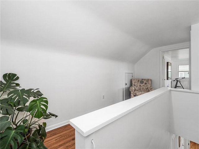 707 Atlantic Ave, Monaca, PA 15061 - hallway featuring lofted ceiling, dark wood-type flooring, baseboards, and an upstairs landing