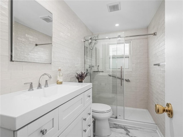 707 Atlantic Ave, Monaca, PA 15061 - full bathroom with toilet, a shower stall, vanity, tile walls, and marble finish floors