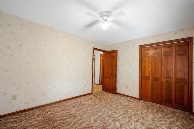 297 Alamae Lakes Rd, South Franklin, PA 15301 - unfurnished bedroom with carpet floors, a closet, a ceiling fan, and wallpapered walls