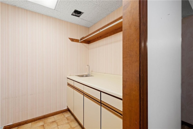 297 Alamae Lakes Rd, South Franklin, PA 15301 - laundry room featuring a sink and baseboards