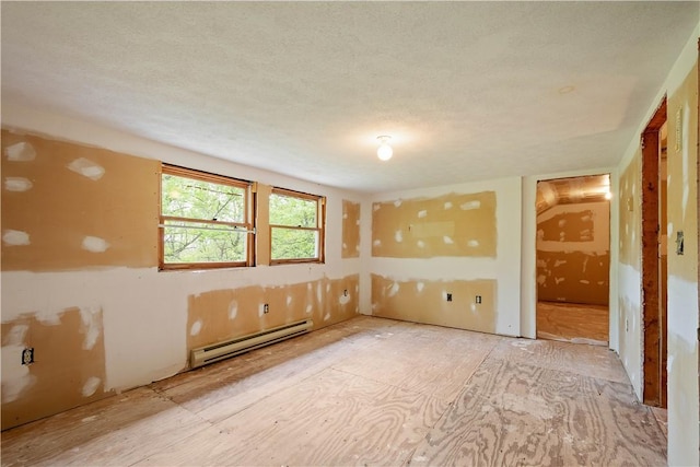 297 Alamae Lakes Rd, South Franklin, PA 15301 - unfurnished room featuring a baseboard heating unit and a textured ceiling