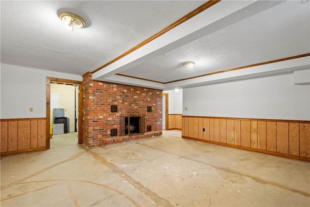 297 Alamae Lakes Rd, South Franklin, PA 15301 - unfurnished living room featuring wainscoting, a fireplace, a textured ceiling, and wood walls