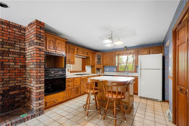 297 Alamae Lakes Rd, South Franklin, PA 15301 - kitchen with white appliances, light countertops, a sink, light tile patterned flooring, and a chandelier