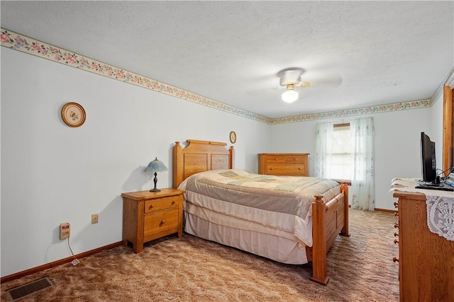 297 Alamae Lakes Rd, South Franklin, PA 15301 - carpeted bedroom with baseboards, a textured ceiling, and a ceiling fan