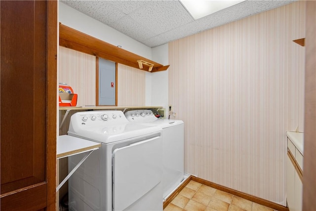 297 Alamae Lakes Rd, South Franklin, PA 15301 - washroom with washing machine and clothes dryer, baseboards, wallpapered walls, and electric panel