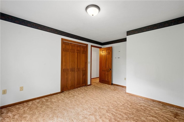 297 Alamae Lakes Rd, South Franklin, PA 15301 - unfurnished bedroom featuring light colored carpet, baseboards, and a closet