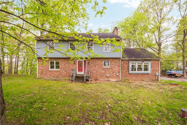 297 Alamae Lakes Rd, South Franklin, PA 15301 - rear view of property with a chimney, a lawn, and brick siding