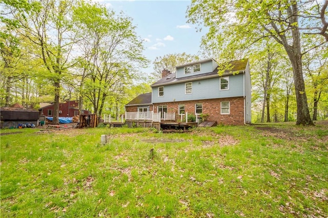 297 Alamae Lakes Rd, South Franklin, PA 15301 - back of house featuring brick siding, a wooden deck, and a chimney