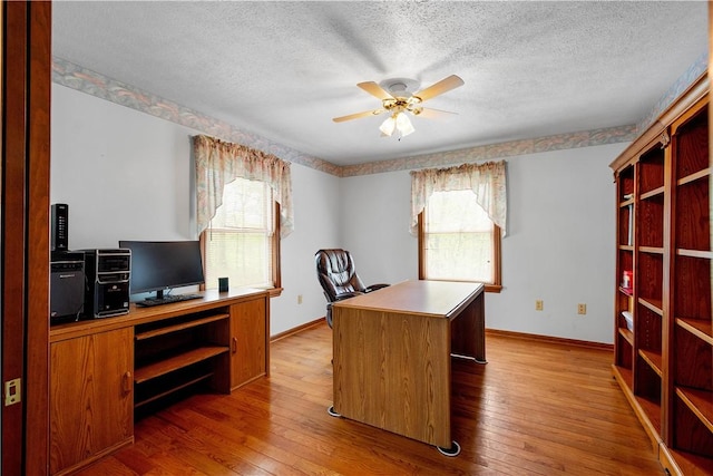 297 Alamae Lakes Rd, South Franklin, PA 15301 - office area with ceiling fan, a textured ceiling, wood-type flooring, and baseboards