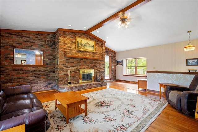 297 Alamae Lakes Rd, South Franklin, PA 15301 - living area with wood finished floors, a brick fireplace, and a ceiling fan