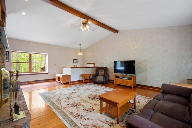 297 Alamae Lakes Rd, South Franklin, PA 15301 - living room with wood finished floors, ceiling fan, wallpapered walls, and baseboards