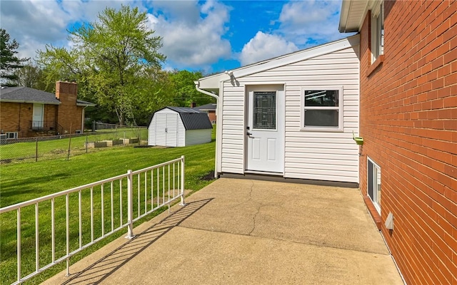 view of patio / terrace with a shed and an outdoor structure