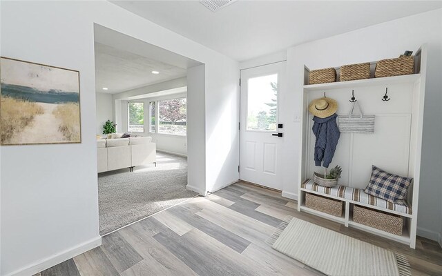 mudroom with wood finished floors, baseboards, and recessed lighting