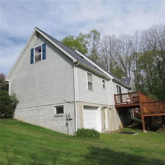 2255 Copper Kettle Hwy, Middlecreek Twp, PA 15557 - rear view of house featuring an attached garage, a deck, and a lawn