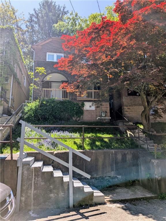 1216 Morrow St, Wilkinsburg, PA 15221 - rear view of house with stairway