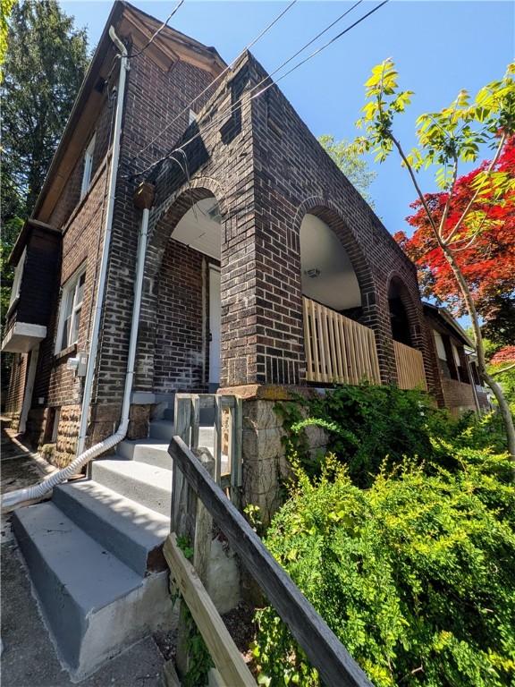 1216 Morrow St, Wilkinsburg, PA 15221 - view of side of home featuring brick siding