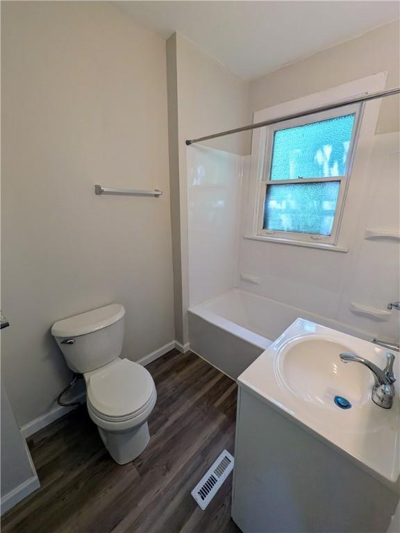 1216 Morrow St, Wilkinsburg, PA 15221 - bathroom with wood finished floors, baseboards, and vanity