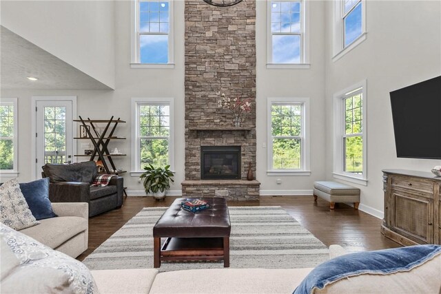 521 Cambridge Ct, Pine Twp Nal, PA 15090 - living room featuring healthy amount of natural light, a high ceiling, dark wood-type flooring, baseboards, and a fireplace