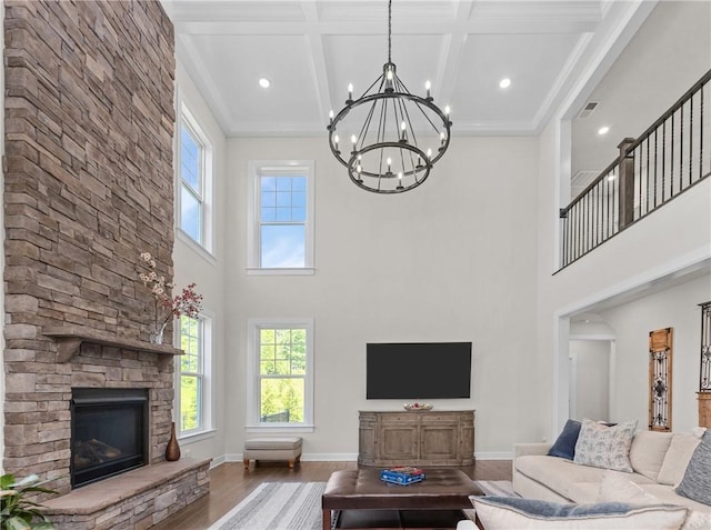 521 Cambridge Ct, Pine Twp Nal, PA 15090 - living room featuring wood finished floors, a towering ceiling, a chandelier, a fireplace, and coffered ceiling