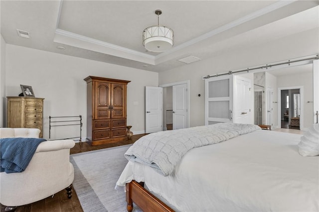 521 Cambridge Ct, Pine Twp Nal, PA 15090 - bedroom featuring a tray ceiling, dark wood finished floors, crown molding, baseboards, and a barn door