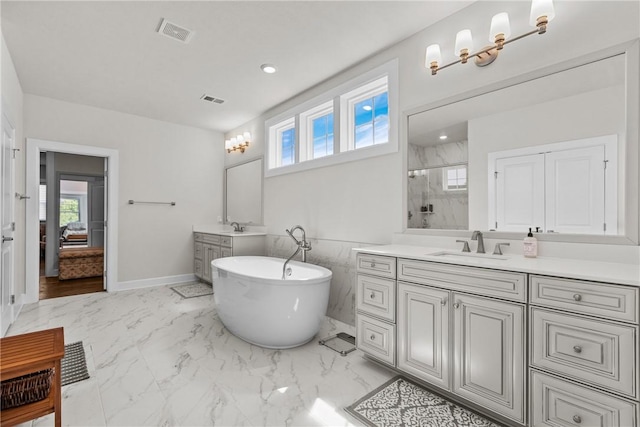 521 Cambridge Ct, Pine Twp Nal, PA 15090 - bathroom with a stall shower, a soaking tub, two vanities, marble look tiles, and baseboards