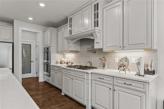 521 Cambridge Ct, Pine Twp Nal, PA 15090 - kitchen featuring appliances with stainless steel finishes, white cabinets, tasteful backsplash, glass insert cabinets, and dark wood-type flooring