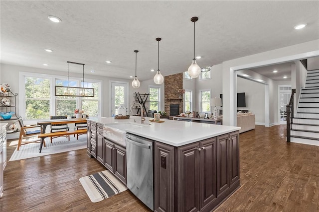 521 Cambridge Ct, Pine Twp Nal, PA 15090 - kitchen featuring dishwasher, a sink, a fireplace, light countertops, and dark brown cabinetry
