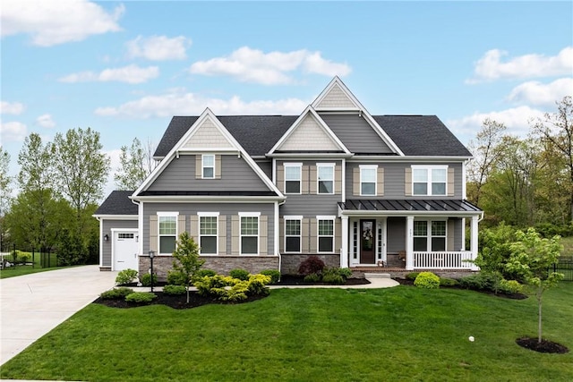 521 Cambridge Ct, Pine Twp Nal, PA 15090 - view of front facade with covered porch, a standing seam roof, concrete driveway, an attached garage, and stone siding