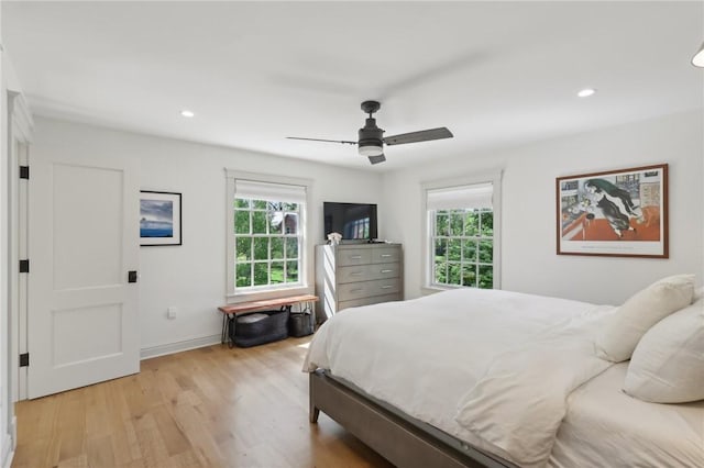 bedroom featuring light wood-style flooring, recessed lighting, a ceiling fan, and baseboards