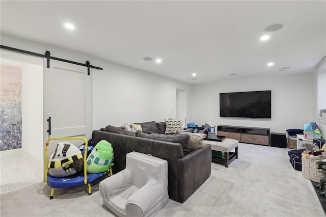 living room featuring recessed lighting and a barn door