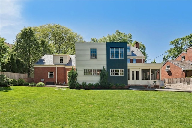 back of house featuring a chimney, french doors, a patio area, and board and batten siding