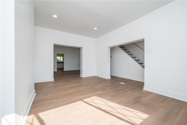 61 Greenbush St, Mt Washington, PA 15211 - empty room with stairway, wood finished floors, and recessed lighting