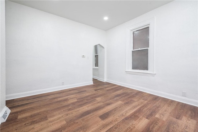 59 Greenbush St, Mt Washington, PA 15211 - empty room featuring arched walkways and dark wood-style flooring