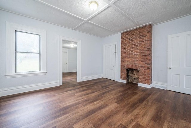 59 Greenbush St, Mt Washington, PA 15211 - unfurnished living room with dark wood-style flooring, a textured ceiling, and a fireplace