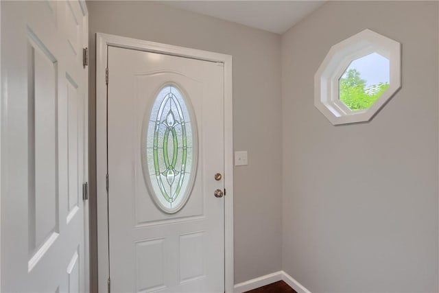 entrance foyer with healthy amount of natural light and baseboards