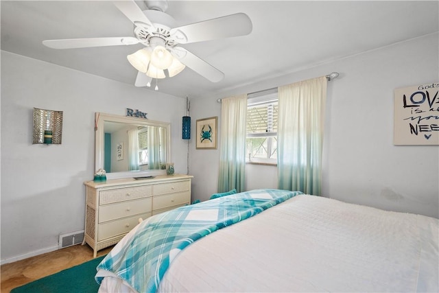 bedroom featuring carpet floors, a ceiling fan, and baseboards