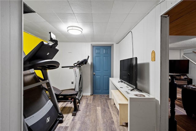 exercise area featuring wood finished floors