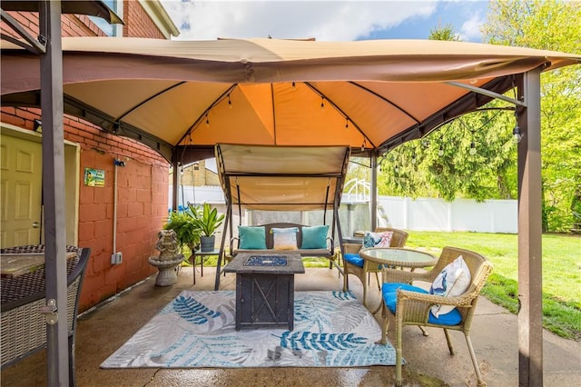 view of patio / terrace with a gazebo and an outdoor fire pit