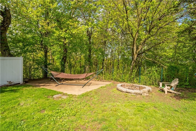 view of yard with an outdoor fire pit
