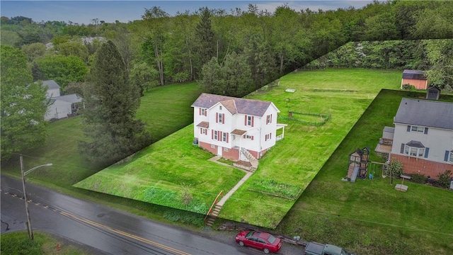 drone / aerial view of a heavily wooded area