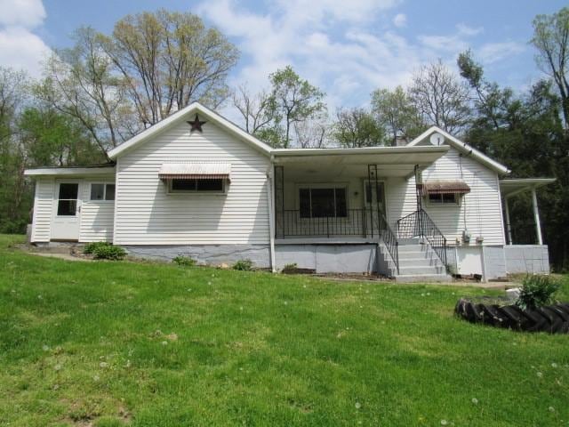 428 Grindstone Rd, Jefferson Twp Fay, PA 15442 - rear view of house with a yard and covered porch