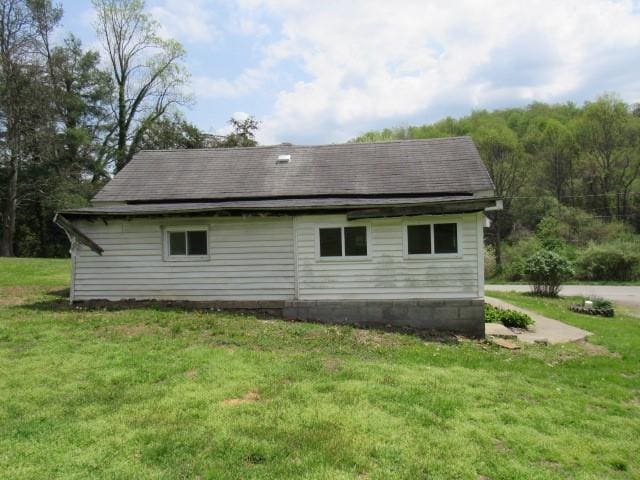 428 Grindstone Rd, Jefferson Twp Fay, PA 15442 - view of side of property with a lawn and a shingled roof