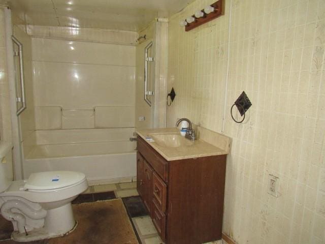 428 Grindstone Rd, Jefferson Twp Fay, PA 15442 - bathroom with toilet, vanity, shower / bathtub combination, and tile walls