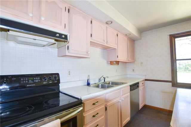 105 Audrey Ln, Jefferson Twp But, PA 16023 - kitchen with appliances with stainless steel finishes, a sink, under cabinet range hood, wallpapered walls, and light countertops