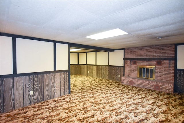 105 Audrey Ln, Jefferson Twp But, PA 16023 - finished basement with a fireplace, wood walls, and carpet floors