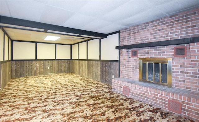 105 Audrey Ln, Jefferson Twp But, PA 16023 - basement featuring wood walls and a brick fireplace