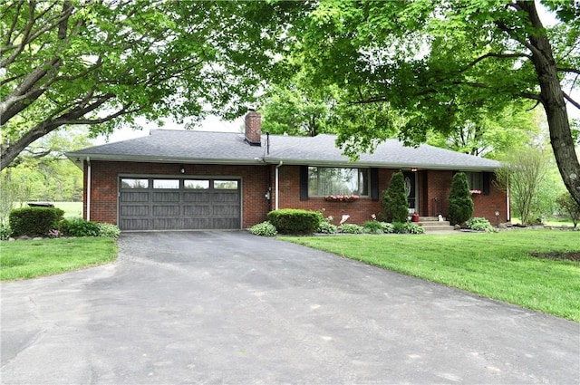 3344 Orangeville Rd, South Pymatuning Twp, PA 16150 - ranch-style home featuring driveway, an attached garage, a front yard, brick siding, and a chimney